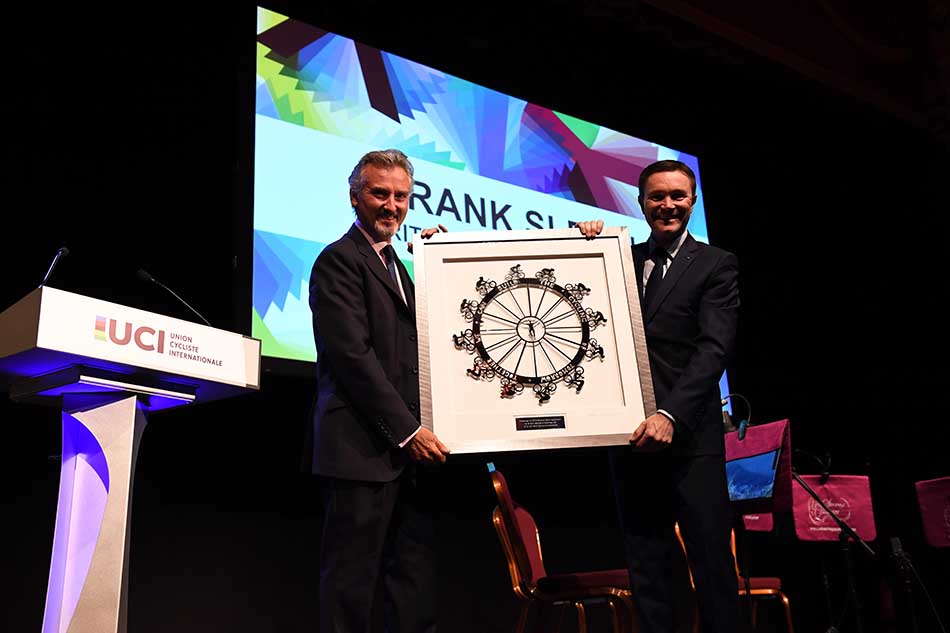 Chairman of British Cycling presents artwork to President of UCI