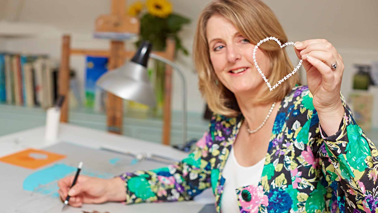 Anita Bowerman creating a new paper cutting artwork